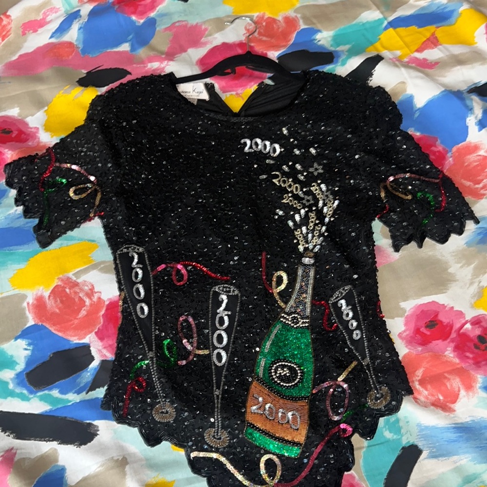 This vintage hand sewn sequin shirt is 23 years old with one blemish!  See video